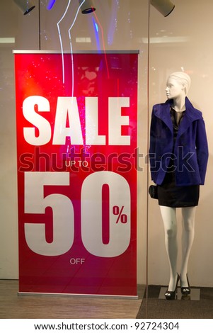 Red sale banner outside of fashion shop