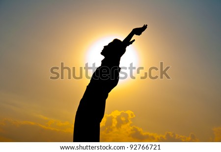 Silhouette of free boy happy and victory