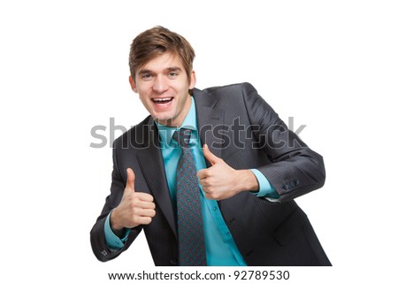 Handsome excited young business man hold hands with thumb up gesture, businessman happy smile, wear elegant suit and tie isolated over white background