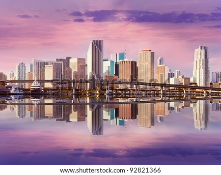 Miami Florida panorama of downtown residential and office buildings and hotels, with Biscayne bay water reflections and colorful sky on a beautiful day. Famous travel location.