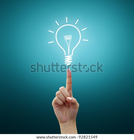 Bulb light on women Fingertip on blue background