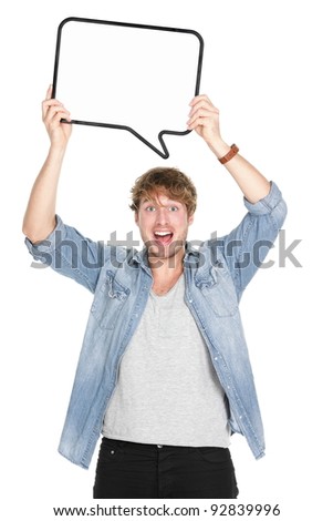 Man holding sign speech bubble screaming excited. Young casual caucasian man in his twenties. Isolated on white background.