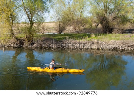 Man paddeling in Kayak in Danube Delta