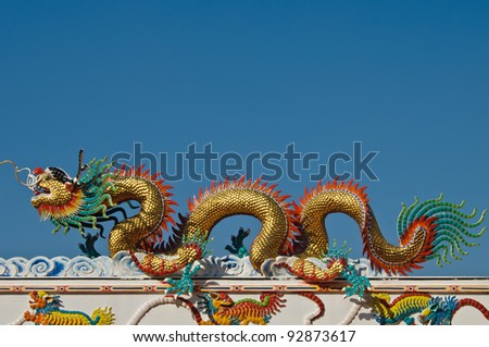 Chinese style dragon Statue on the temple's roof, Thailand.