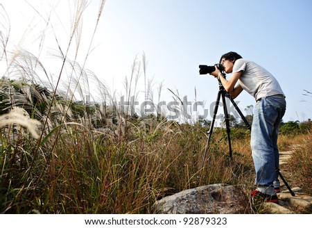 photographer taking photo in wild