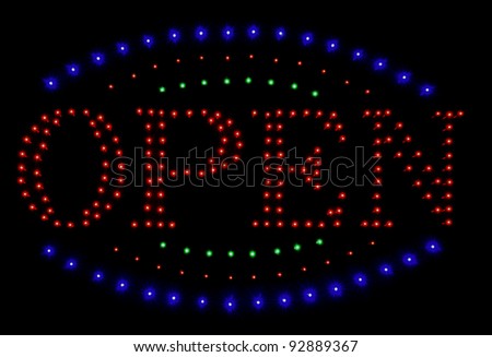 Neon sign open against a black background