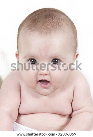 Little baby girl taken on white background