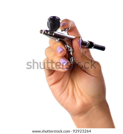Makeup artist holding the tools of her trade Royalty-Free Stock Photo #92923264