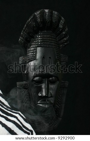 African Tribal mask with zebra skin and smoke
