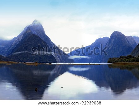 reflection of high mountain glacier at milford sound, New Zealand