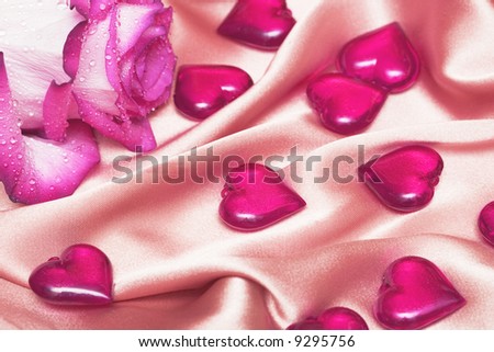 pink rose on satin with hearts