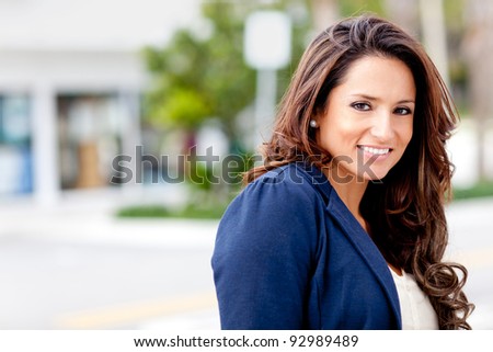 Beautiful Latin woman looking happy and smiling