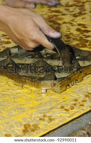 Hand drawn batik pressed using block on pure silk.