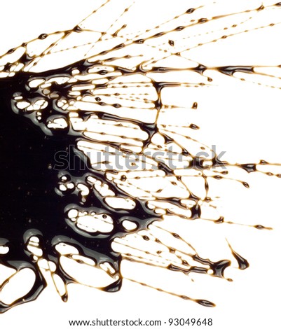 Chocolate syrup leaking on white background