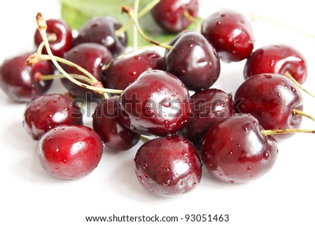 Wet cherries on white background