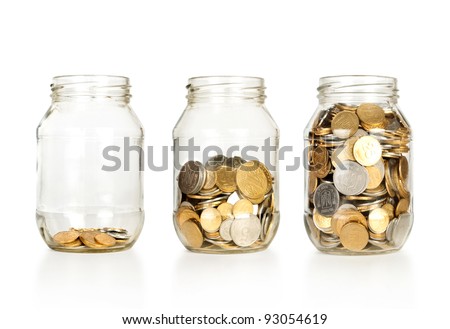 Glass jars with coins like diagram, isolated - savings concept Royalty-Free Stock Photo #93054619