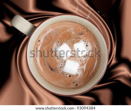 A rich cup of hot chocolate against a silky brown background