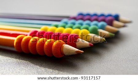 colored pencils on a black desk