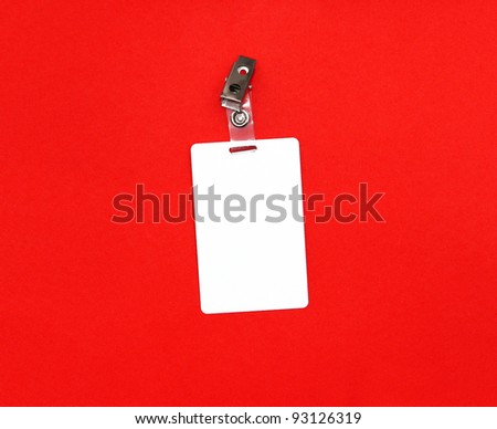 Press badge or ID pass with clip isolated on red background