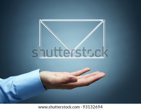 Human hand presenting futuristic transparent mail icon