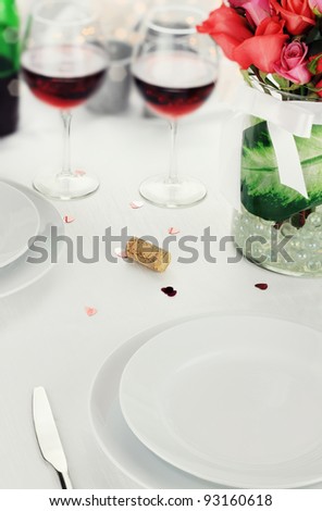 Romantic table setting with selective focus on lower portion of image.  Shallow depth of field.