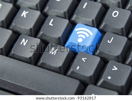 WiFi icon on blue keyboard button. Concept on computer keyboard.