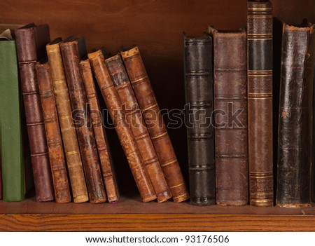 Antique books on bookshelf Royalty-Free Stock Photo #93176506