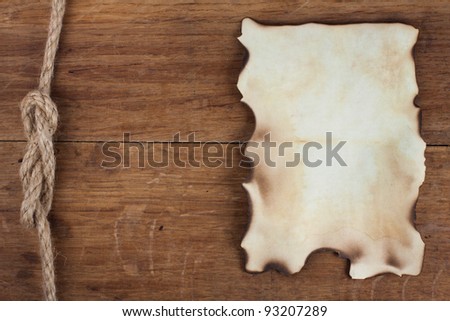 Old Burnt Paper on Wood background