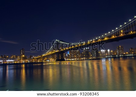  Manhattan Bridge and lower Manhattan at night ,New York City, USA