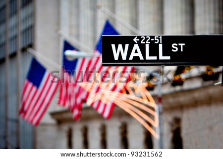 Wall street sign in New York with New York Stock Exchange background Royalty-Free Stock Photo #93231562