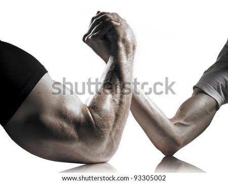 A heavily muscled man arm wrestling a puny weak man