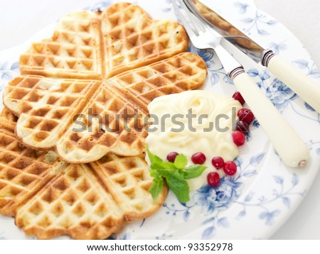 sweet wafer hearts on dish with cream, berries and mint Royalty-Free Stock Photo #93352978