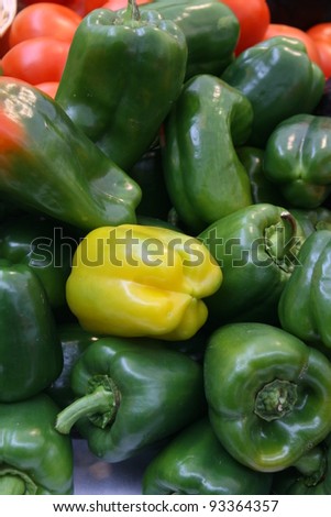 yellow and green peppers in baskets for sale to the market