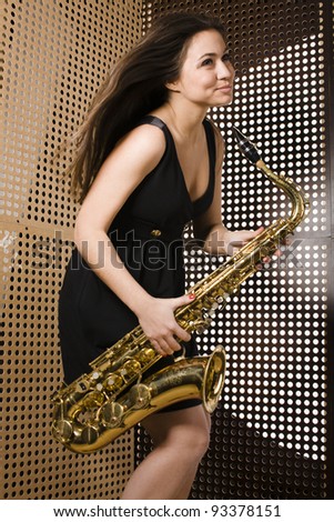 pretty young woman with saxophone