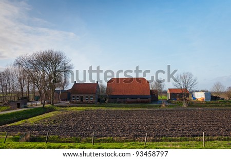 Traditional farmhouse with stable and barn near the small Dutch village of Blauwe Sluis.