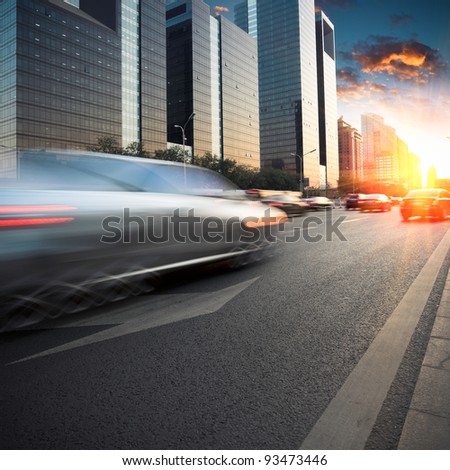 city traffic in dusk at modern street