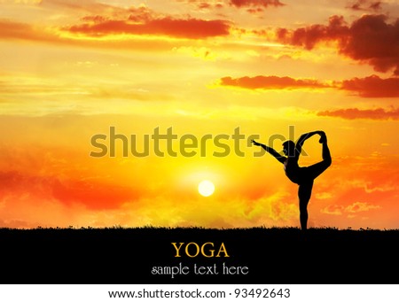 Yoga Natarajasana dancer balancing pose by Man in silhouette with dramatic sunset sky background. Free space for text