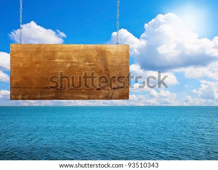 Sign board near the sea on sunny day with beautiful sky
