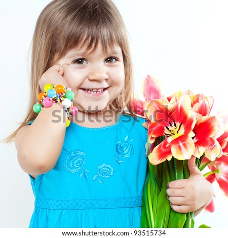 Picture of litlle girl with tulips in hands over white