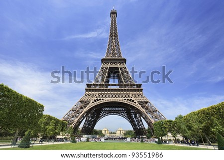 The famous Eiffel Tower in Paris against a dramatic blue sky Royalty-Free Stock Photo #93551986