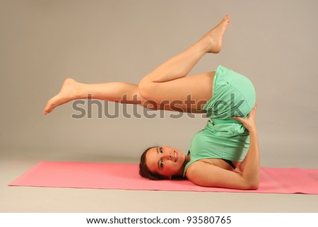 beautiful young woman practicing yoga