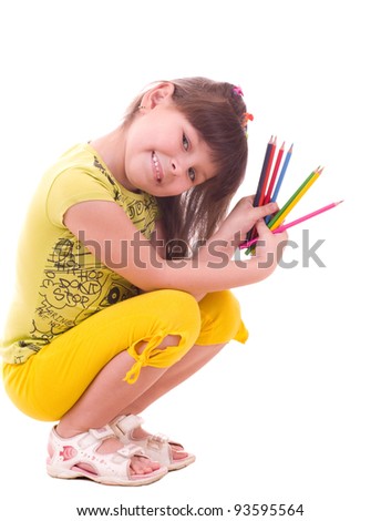 Beautiful little girl with color pencils on white background