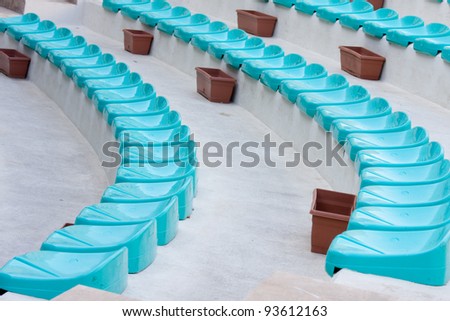colorful plastic chairs in a stadium