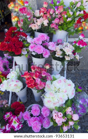 numerous bouquets of flowers and gifts to be purchased
