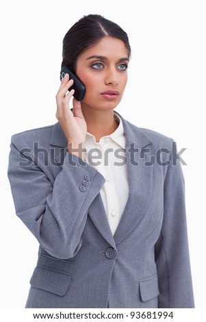 Female entrepreneur on her mobile phone against a white background