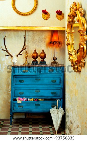 baroque grunge vintage house with blue drawer and golden mirror