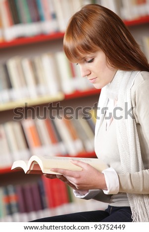 Young student reading in a library