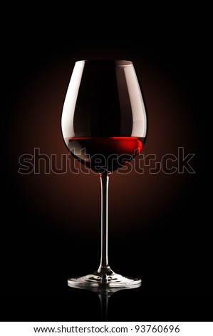 re wine glass on black background
