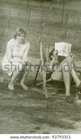 Vintage photo of couple relaxing outdoor (sixties)