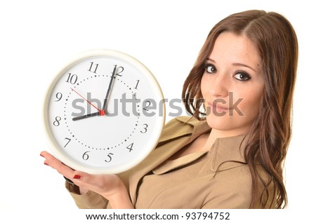 Pretty smiling brunette woman holding a clock